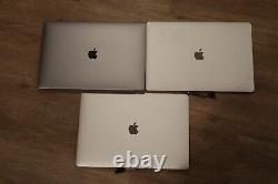 Three Apple Macbook Pro 2017 Pro 15 in LCD Displays (Silver and Space Grey)